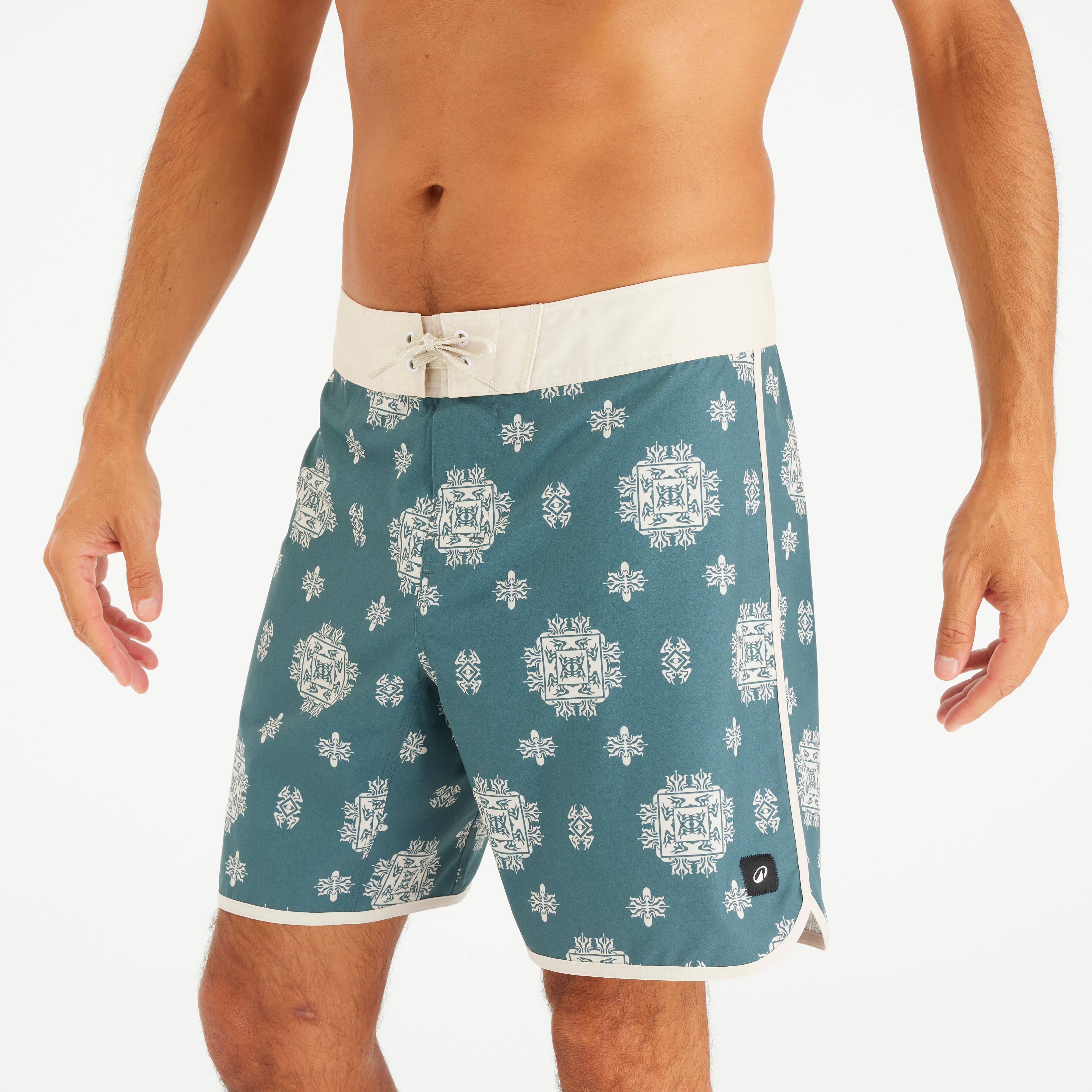 Spodenki surfingowe męskie Olaian 500 19 Arch Spring,Boardshort o długim kroju ogranicza podrażnienia na udach. Tkanina stretch ułatwia poruszanie się podczas surfowania. Pasek zapewnia ich podtrzymanie. Boczna kieszeń na suwak. Płaski pasek zapewnia stab
