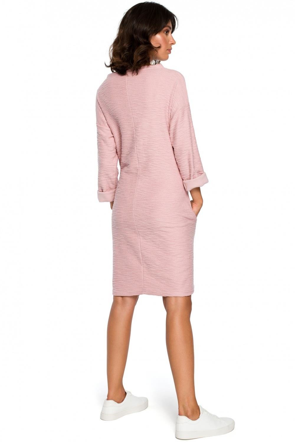 Opis: Ciepła dzianinowa sukienka z kieszeniami sportowy styl różowa bawełna.