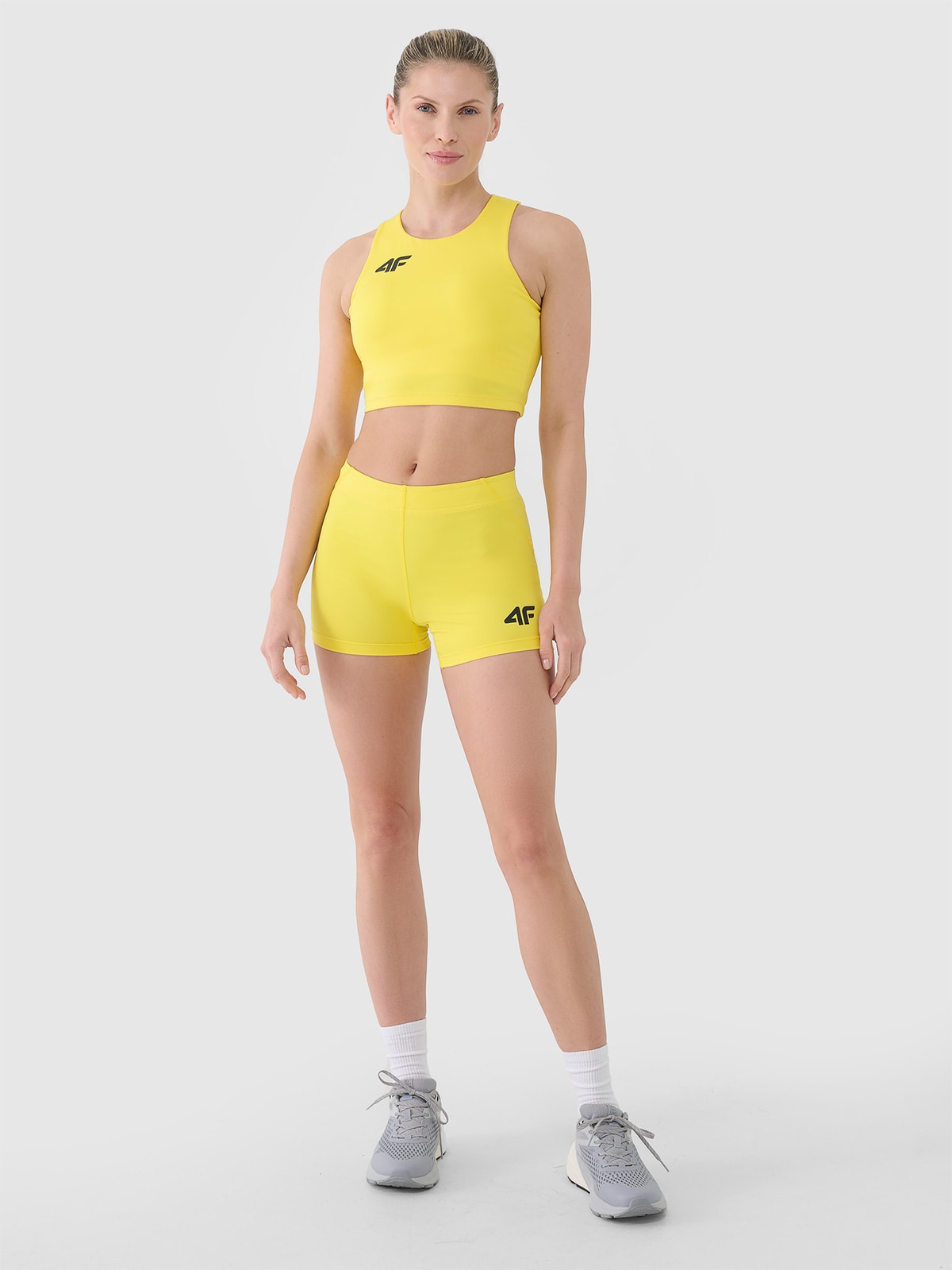 4F Legginsy krótkie treningowe damskie - żółte XL