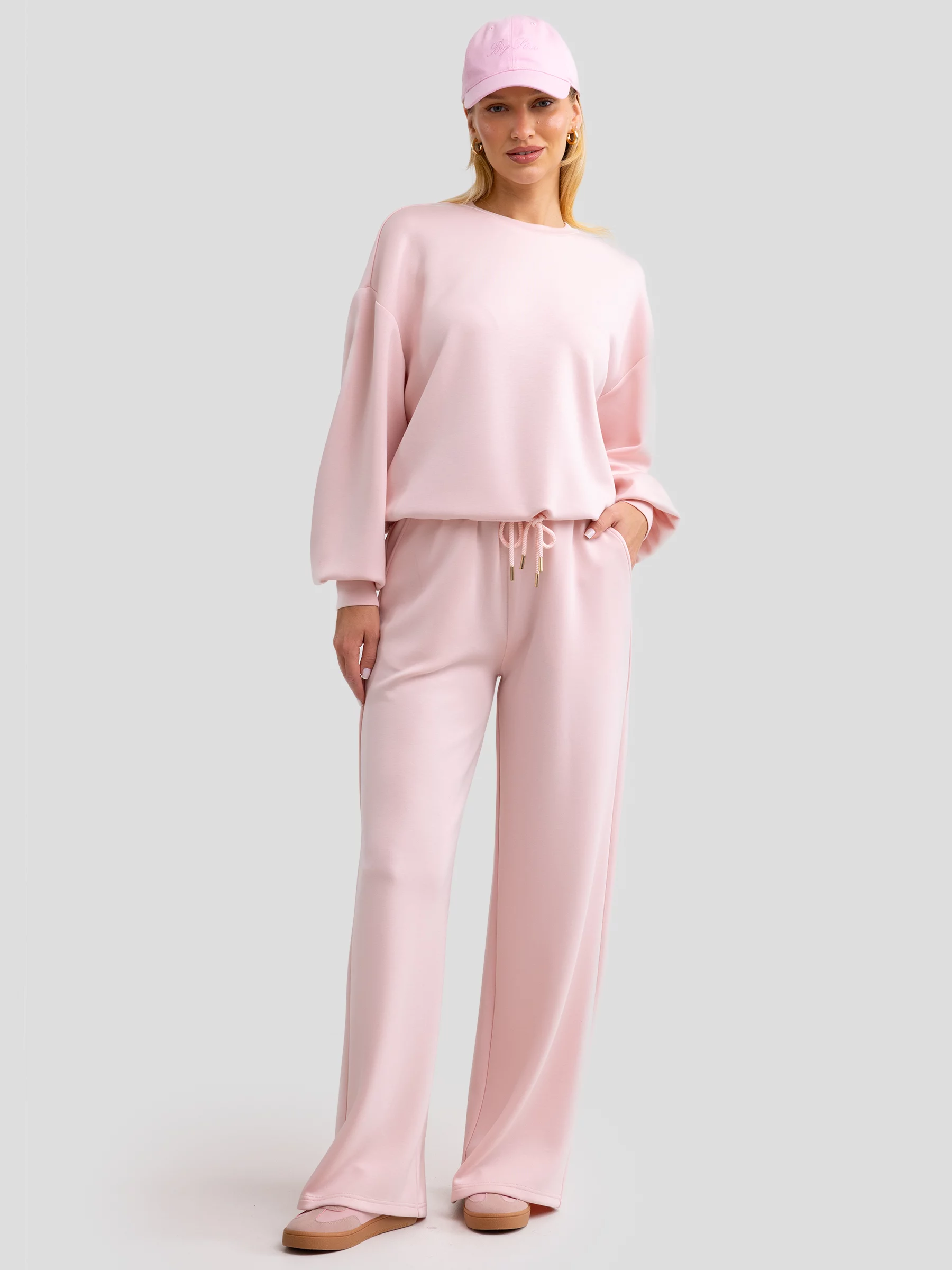 Spodnie damskie dresowe z szeroką nogawką jasnoróżowe Lunarap 600