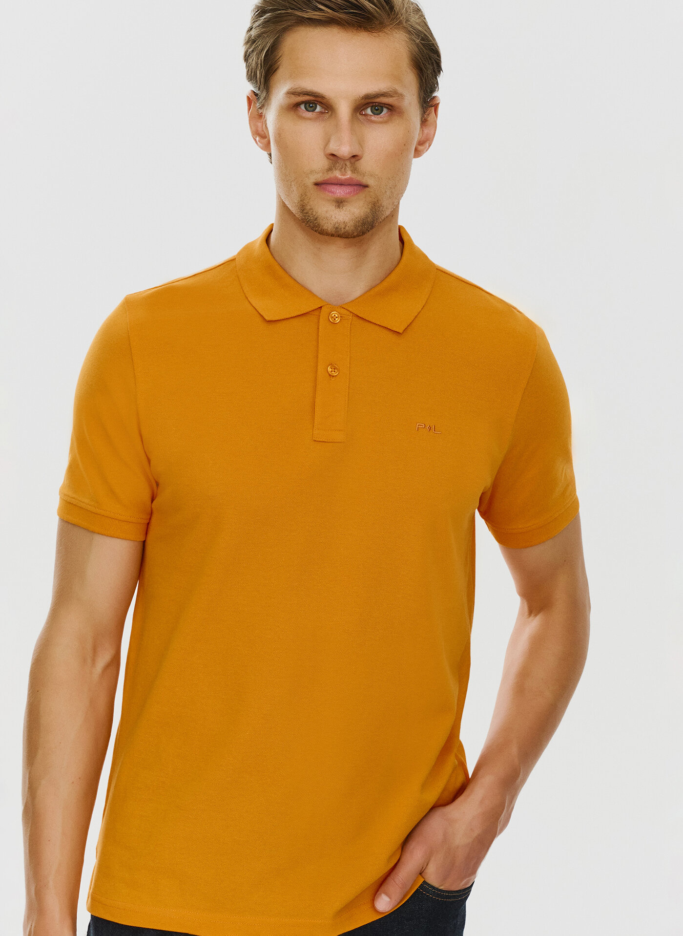 Gładki t-shirt polo w pomarańczowym kolorze - Pako Lorente