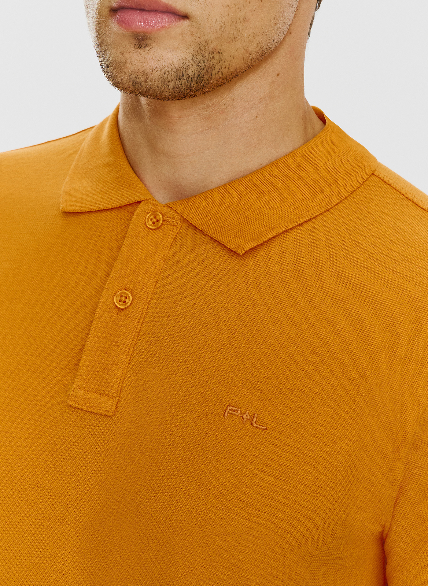 Gładki t-shirt polo w pomarańczowym kolorze - Pako Lorente