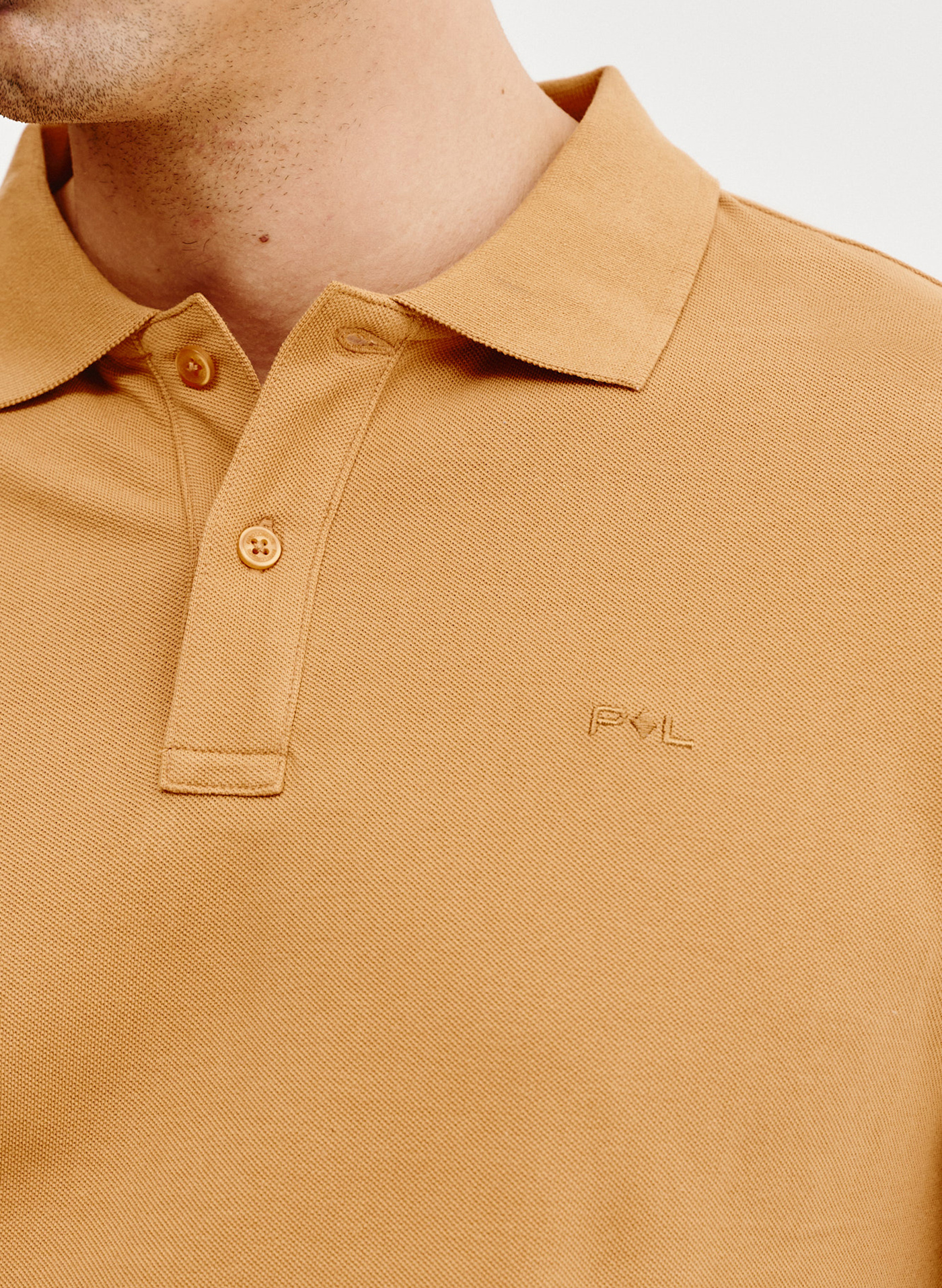 Gładki t-shirt polo w pomarańczowym kolorze - Pako Lorente