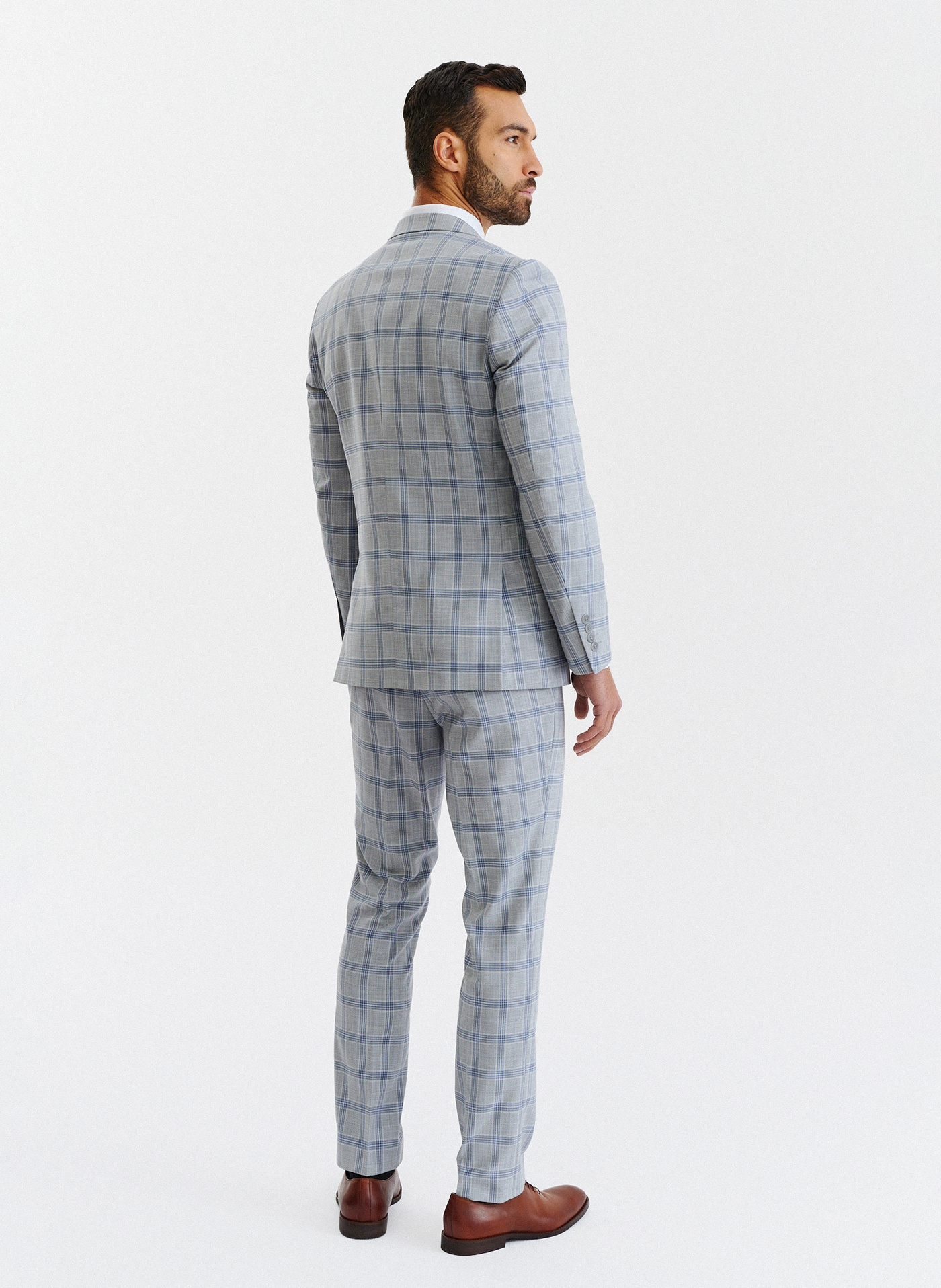 Szare spodnie garniturowe w niebiesko-białą kratę - Pako Lorente